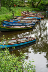 Boats docked at canal , Lakes of Killarney, Killarney National Park, County Kerry, Ireland near Castle Ross