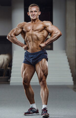 Fototapeta na wymiar Caucasian man pumping up muscles. fitness training