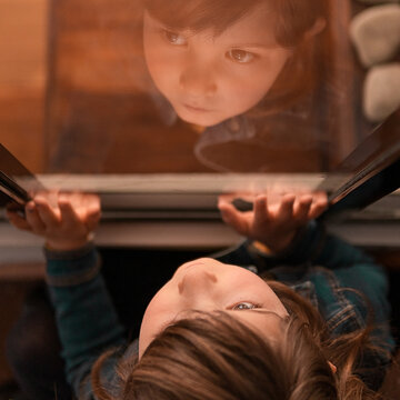 Young Girl Reflecting in Window