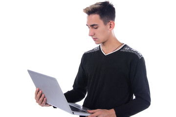 Attractive student. Books and laptop. White background.