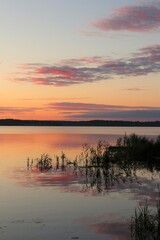 Fototapeta premium Orange idyllic sunset over the lake. Sunset collection. 