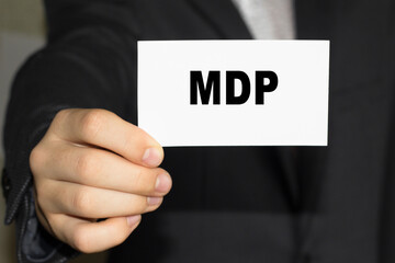 Card with text MDP on hand. You can use in business, marketing and other concepts. Messege of the day.