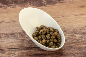 Tasty capers in the bowl