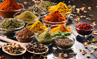 Variety of spices and herbs on kitchen table