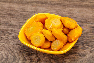 Marinated yellow patisson in the bowl