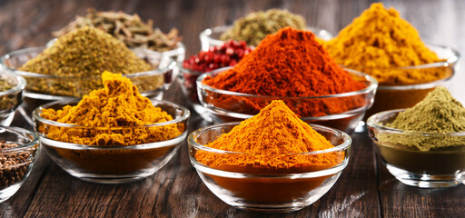 Variety of spices and herbs on kitchen table