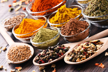 Variety of spices and herbs on kitchen table