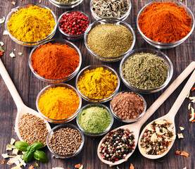 Variety of spices and herbs on kitchen table