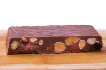 Almond nougat, typical Christmas dessert on wooden background