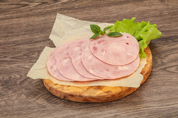 Slised ham snack over board