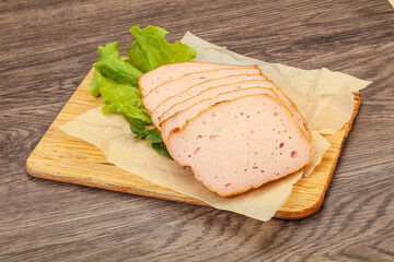 Boiled pork sausage over board