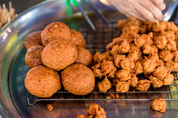 Deep-fried shrimp in street food to chinese banquet food preparation. fat from trans-fat concept. 