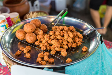 Deep-fried shrimp in street food to chinese banquet food preparation. fat from trans-fat concept. 