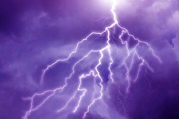 Fototapeta na wymiar Lightning in dark cloudy sky during thunderstorm