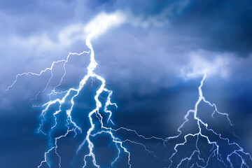 Naklejka na ściany i meble Lightnings in dark cloudy sky during thunderstorm