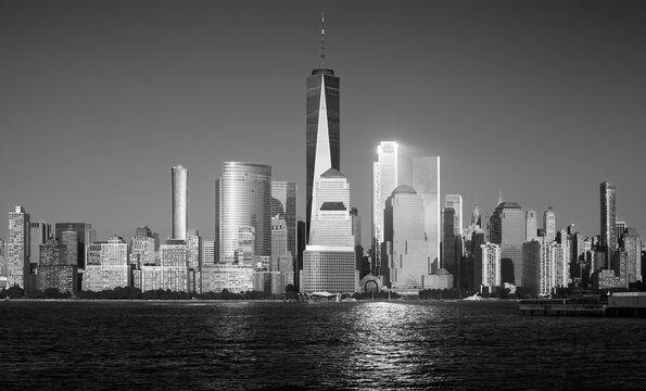 Black and white photo of Manhattan at sunset, New York City, USA.