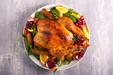 Roast whole chicken served on plate