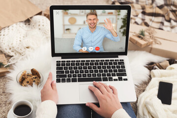 Wife And Husband Communicating Via Video Call At Laptop Indoors