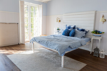Nice cozy interior of a spacious room in gentle blue tones