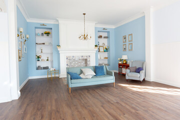 Fototapeta na wymiar Nice cozy interior of a spacious room in gentle blue tones