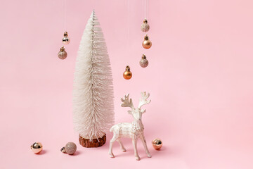 Christmas minimalist composition with white tree, reindeer and hanging baubles