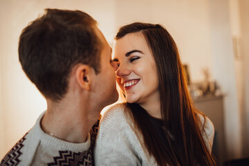 a guy and a girl celebrate the new year together. and give each other gifts
