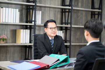 businessman wearing formal suit interviewing new candidate for new employment position in the financial office. new normal work from home concept. 