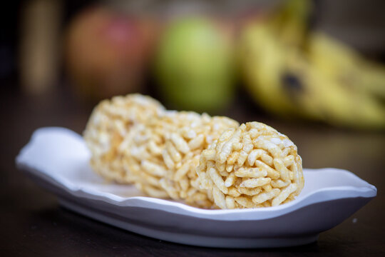 View of sweet puffed rice balls(also known as muri, porri) in a bowl. Muri ball is famous sweet of indian subcontinent made with muri and jaggery