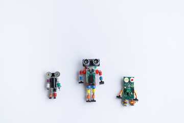 A metal robot and an electronic board that can be programmed. Robotics and electronics. DIY robotics. Mathematics, engineering, science, technology, computer code. STEM and STEAM education for kids. 