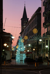 Christmas lights come on at sunset in the city center.stunning city decorations in December