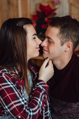 a guy and a girl celebrate the new year together. and give each other gifts