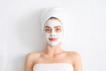 Young beautiful woman with face mask on