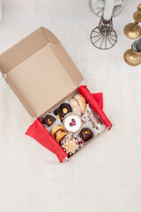 Craft red gift box with sweets cookies and caramel jar for chtistmas and new year