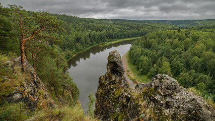 landscape with river, forest and rock on the side