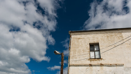 Fototapeta na wymiar old house and window in the sky