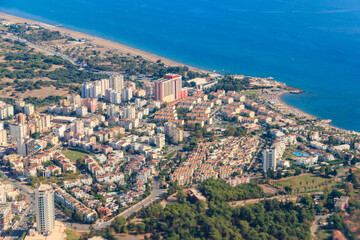 Fototapeta na wymiar Aerial view of Antalya city and the Mediterranean sea in Turkey. View from a plane