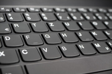 Close up of black gray laptop keyboard (diminishing perspective, selective focus on key of letter Y)