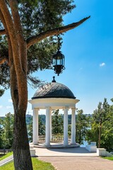 Russia, Kostroma, July 2020. Beautiful vintage gazebo by the river.