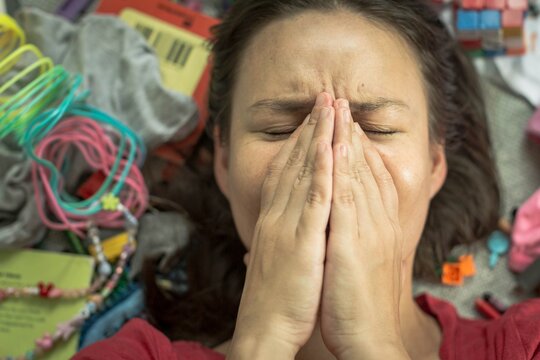 A Stressed Out Busy Mother At Home. Messy House.