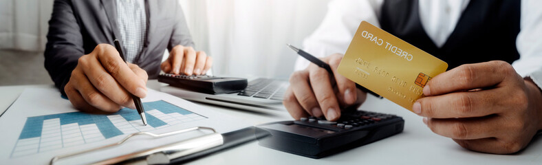 businesswoman hand using smart phone, tablet payments and holding credit card online shopping, omni...