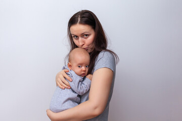 mother with a baby in her arms on a white background