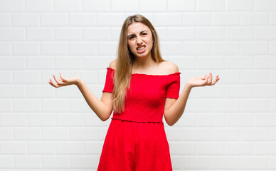 blonde woman feeling clueless and confused, not sure which choice or option to pick, wondering