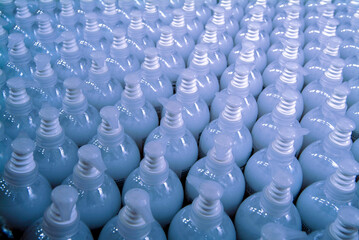 Cosmetic Production industry, transparent plastic bottles filled with liquid soap
