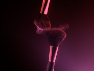 Make up brushes with powder splashes explosion