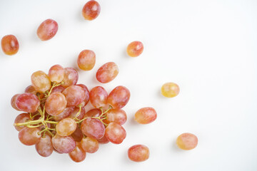 Bunch of grapes on white background. Wine, menu, recipe concept. Top view, flat lay, copy space