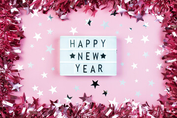 Pink tinsel frame border decor. Christmas template with sparkle star confetti and Happy New Year...