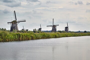 Old windmills on dutch landscape