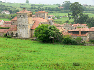 Church of Santa Juliana in Santillana del Mar, Spain with green field in the foreground