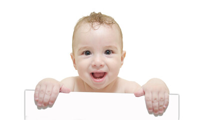 naked wet happy funny kid in bathtub holding an empty piece of paper with place for text on isolated background. child with blank banners in hands.