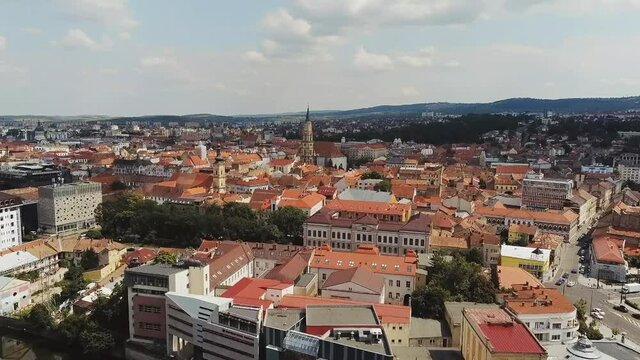Cluj-Napoca,Cluj/Romania-07.20.2019-Sfantul Mihail Church,located in the center of the city,in Matei Corvin Square (Mathias Rex).Aerial 4k footage near the tower clock